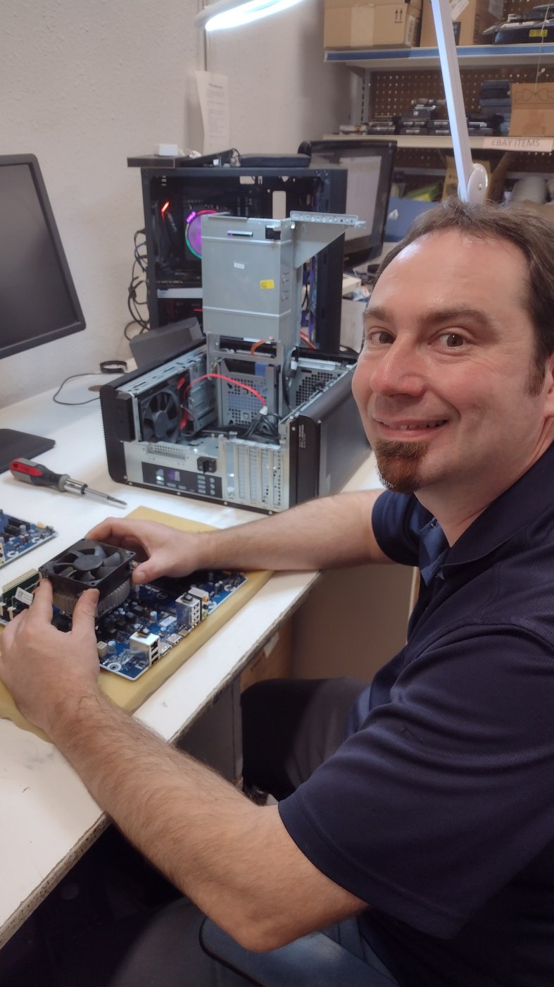 Quick Computer Services owner working on a computer